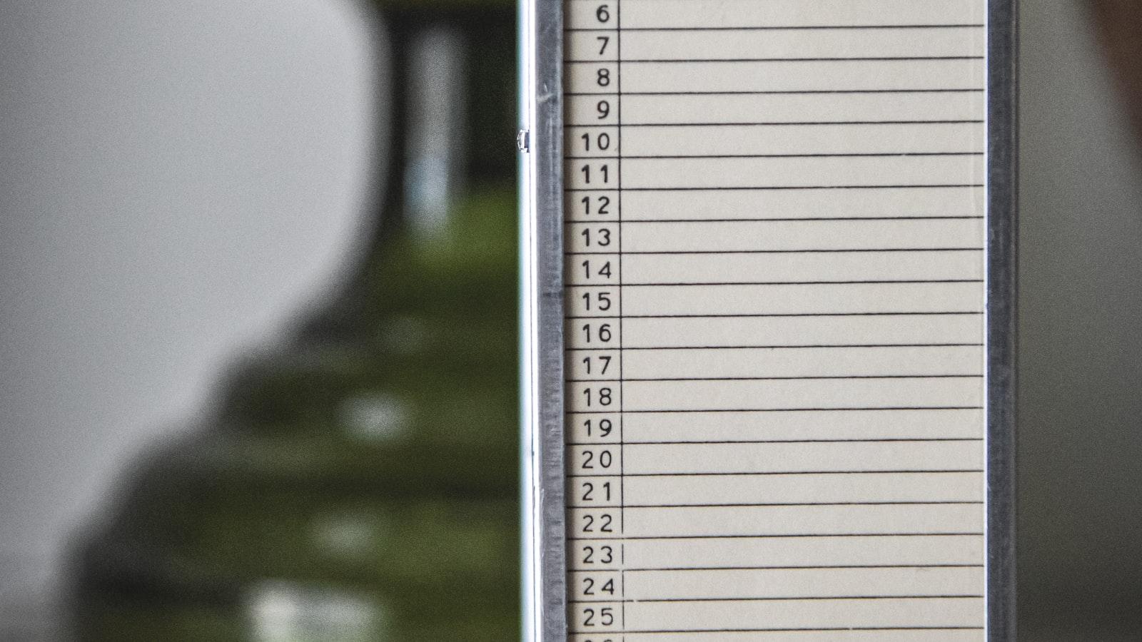 A wooden card-catalog drawer pulled open to reveal densely handwritten index cards, each numbered in the upper corner.